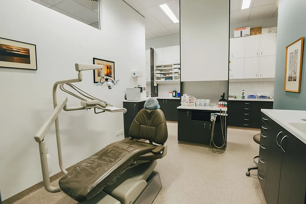 Treatment surgery with dental chair and cabinetry at Beyond Smiles Family Dental